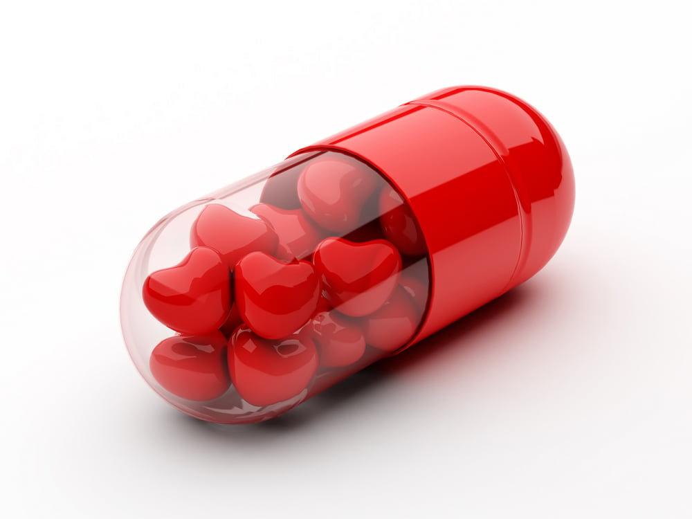 pill capsule with hearts inside