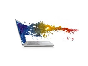 laptop with coloured ink coming out