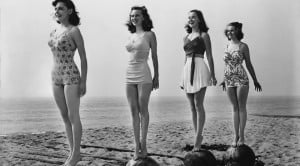 vintage women standing on beach
