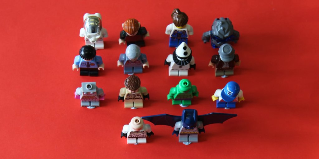 14 lego figures on red