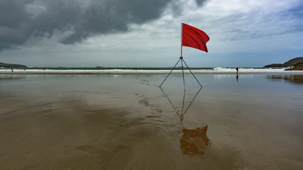 beach with a red flag warning