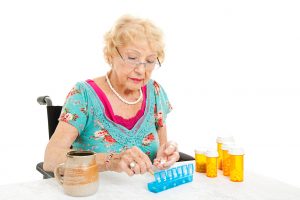 Woman In Wheelchair Counts Pills