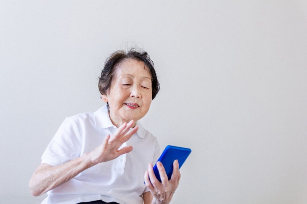 Grandmother having video chat on smart phone
